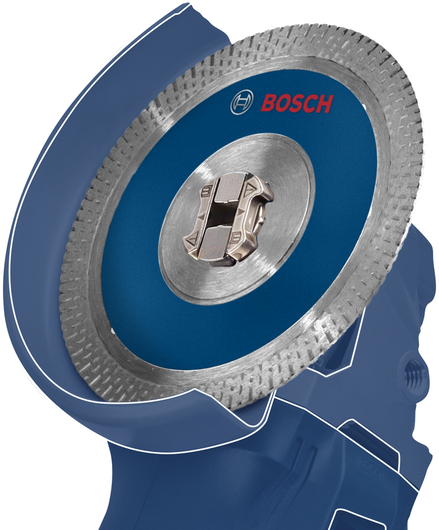 ภาพระยะใกล้ของเครื่องเจียรสีน้ำเงินพร้อมใบเลื่อยวงเดือนติดอยู่.